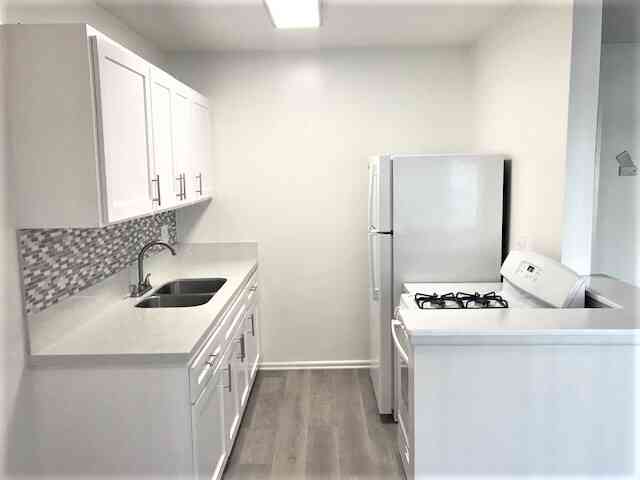 renovated kitchen with white shaker cabinets