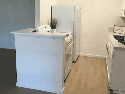 open kitchen layout with hardwood style flooring