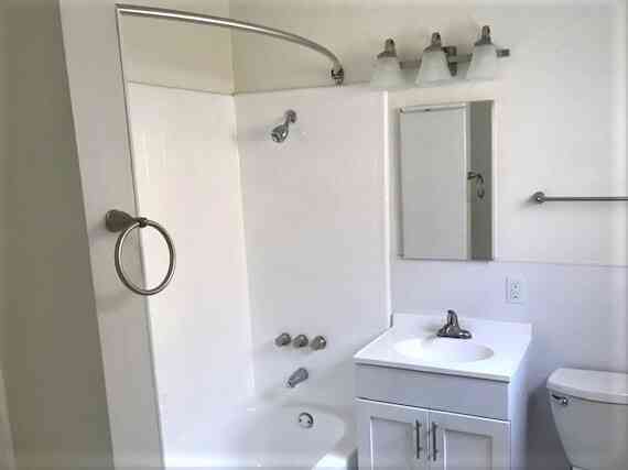 clean full bathroom with modern vanity